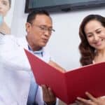 doctor reviews weight loss chart with a patient